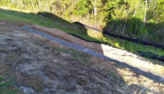 Hoke County Retaining Wall Installed by Cardinal Landscaping. The "Before Picture"